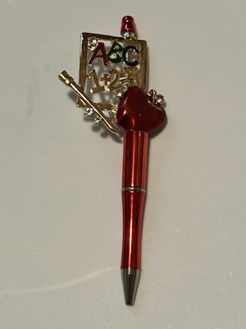 ABC and apple on red pen