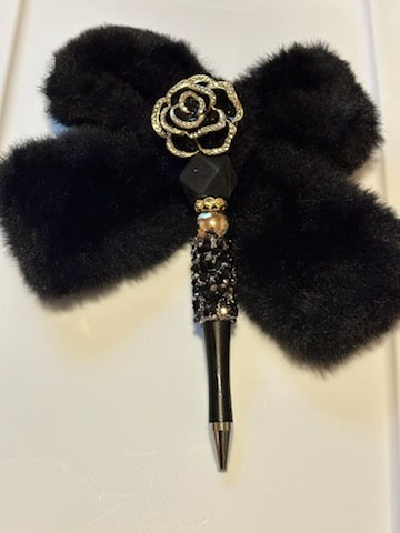 Black fuzzy bow pen