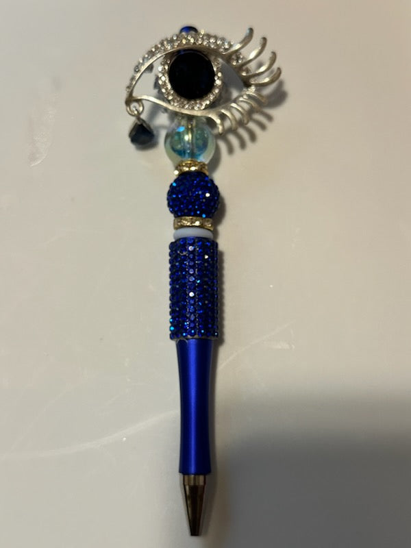 Bling eye with blue tear drop pen