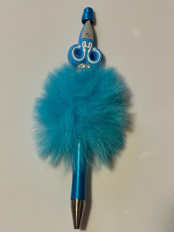 Blue scissors on fuzzy pen