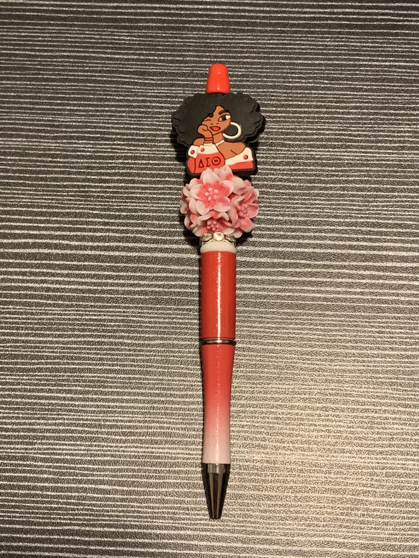 Delta lady with red flower pen