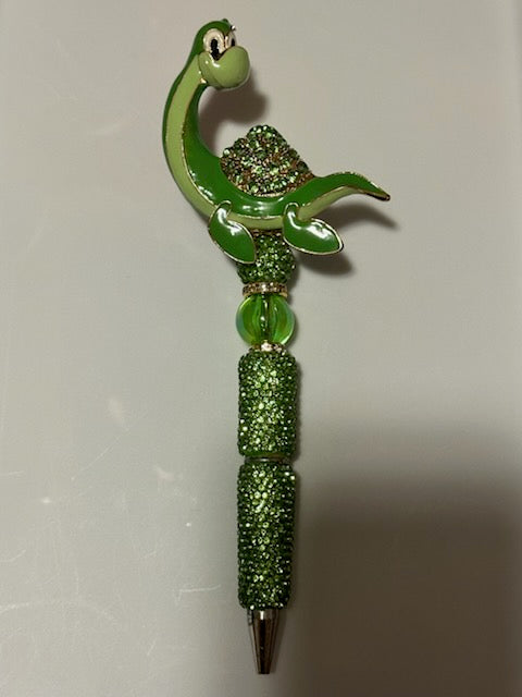 Green dino on rhinestone pen