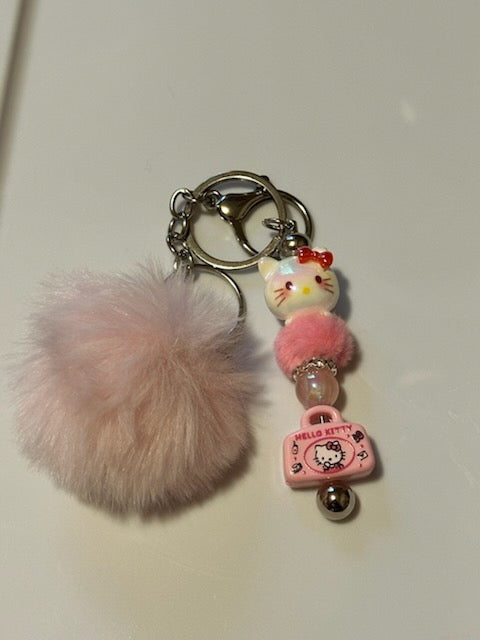 Light pink hello kitty keychain with pom pom