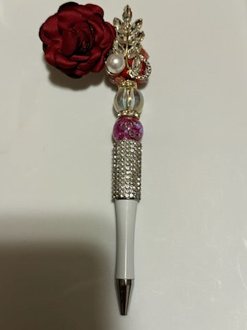 Red rose on whit pen
