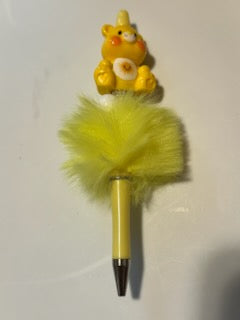 Yellow care bear on fuzzy pen