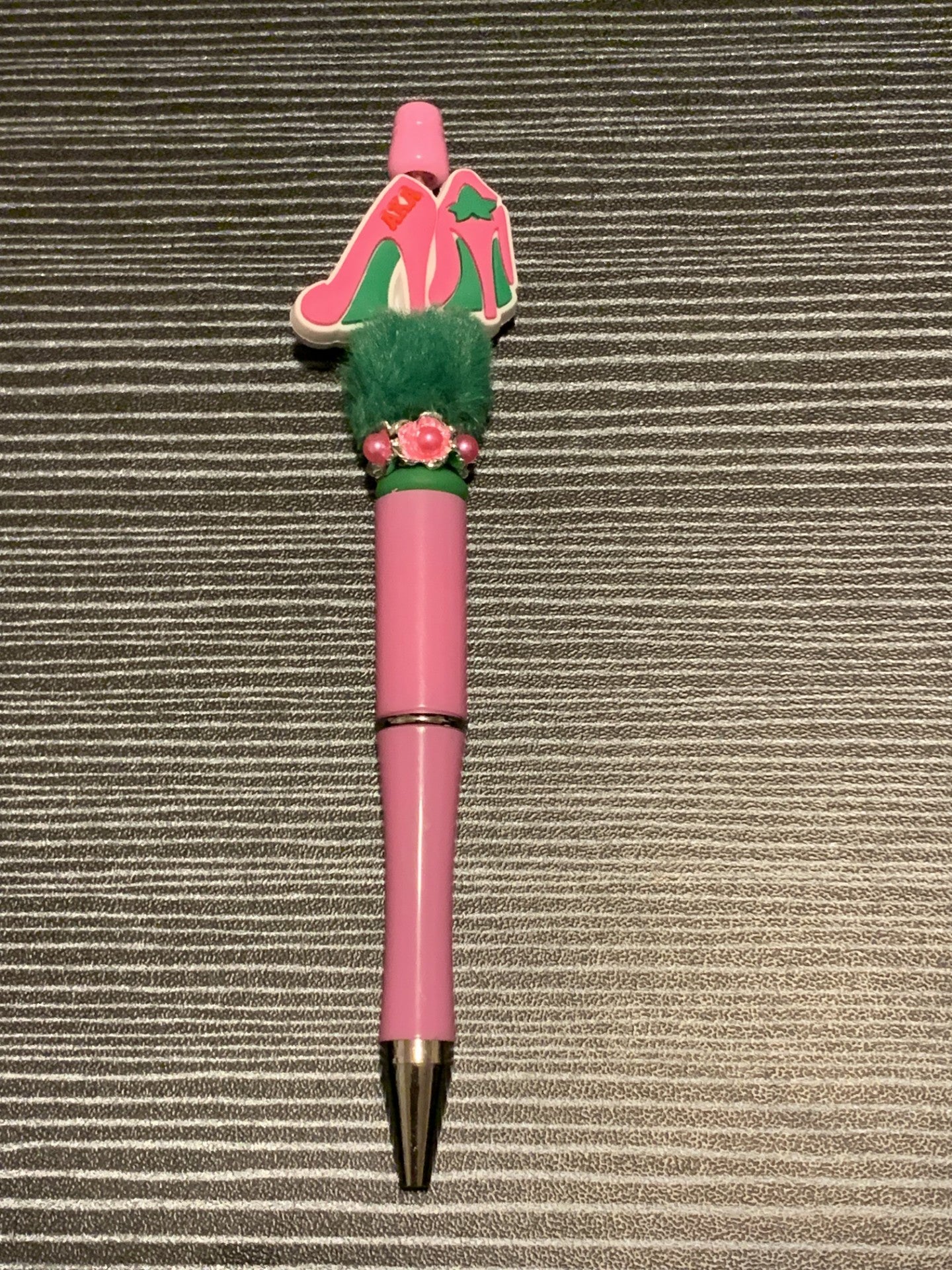 AKA pink heel on green fluff