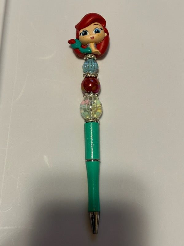 Ariel Laying down pen