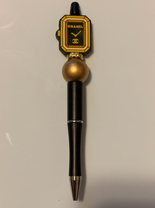 Black and Gold Chanel watch pen