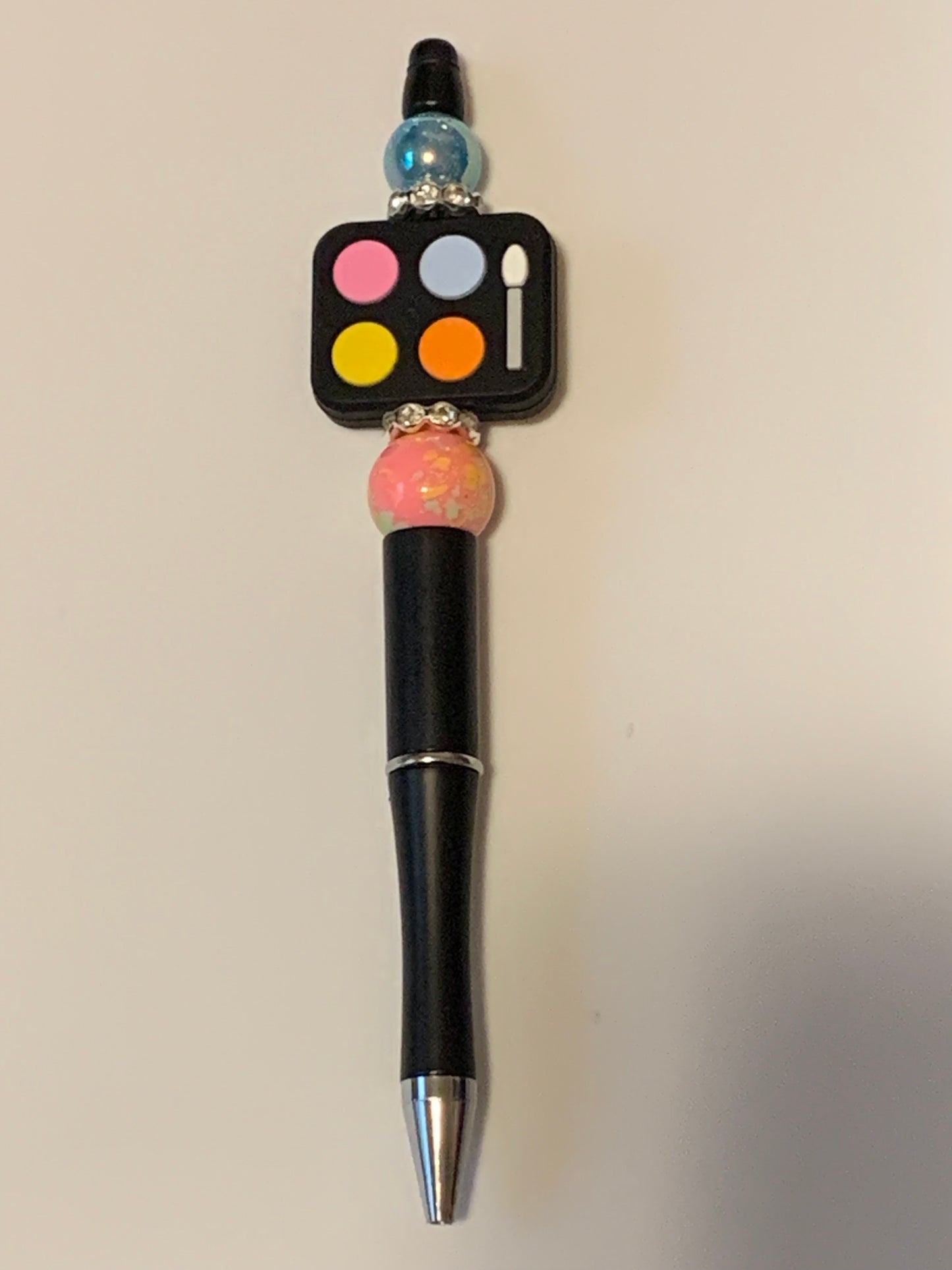 Black and pink Makeup palette pen