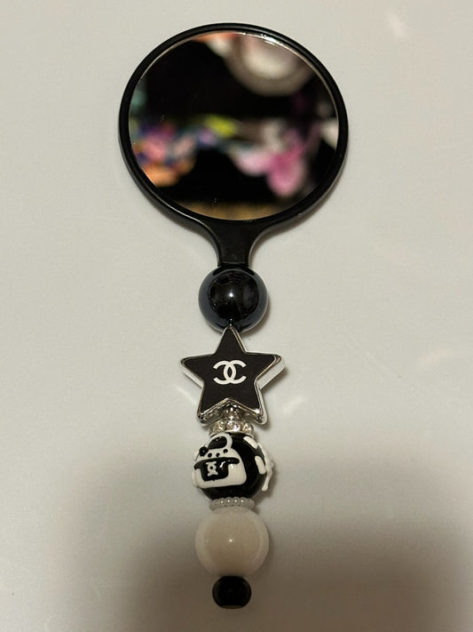 Black compact Chanel Mirror