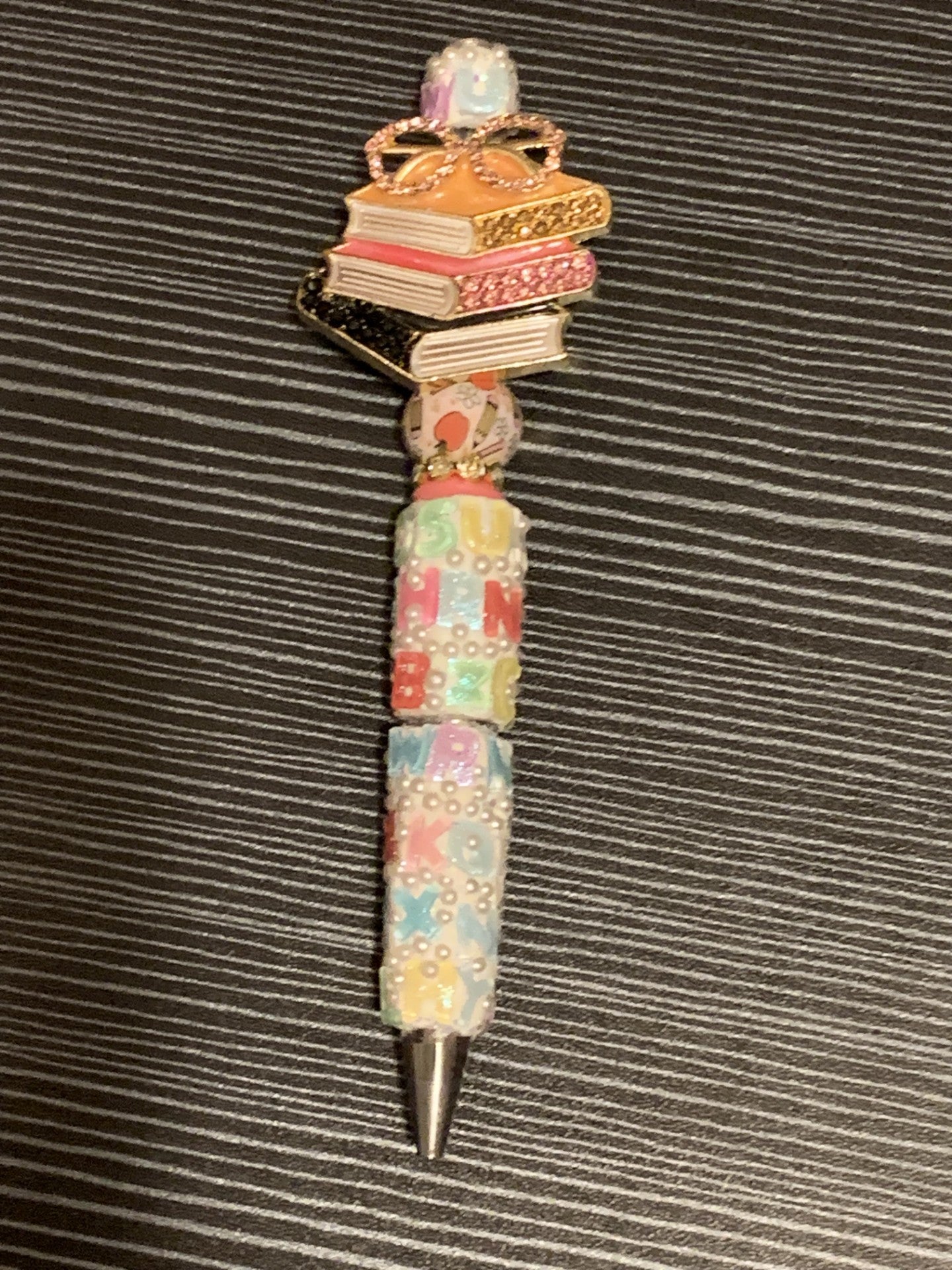Books on a letter pen