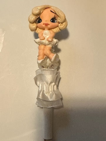 Clay bead of Marilyn Monroe on tool pen