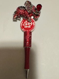 Delta with red elephant charm