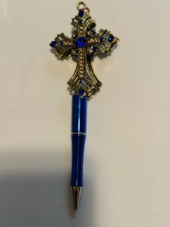 Gold cross on blue pen