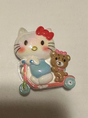 Hello kitty on scooter popscoket
