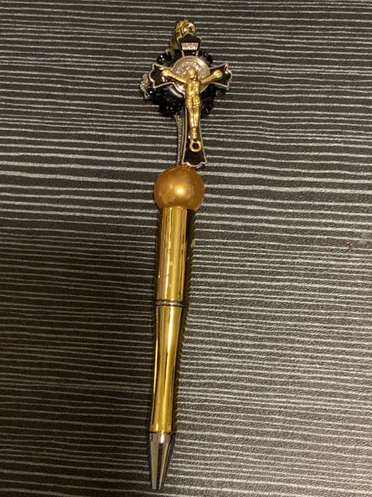 Jesus on a gold cross pen