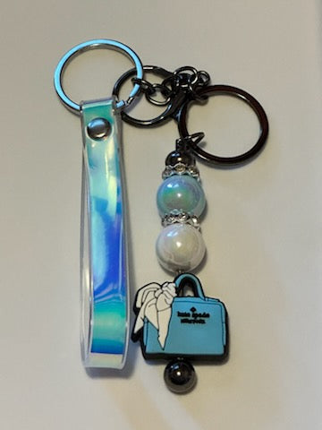Blue Kate Spade purse keychain