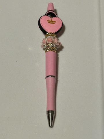 Pink Kate Spade purse pen