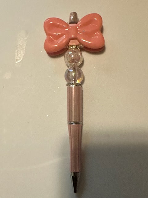 Coral bow pen
