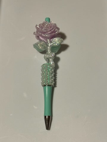 Purple flower on teal pen