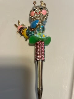 Rainbow bling caterpillar with blue flower