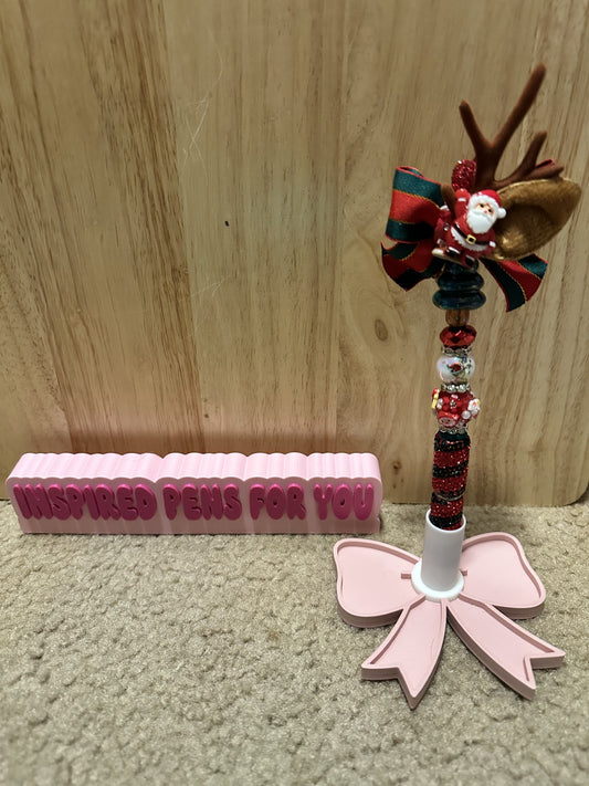 Santa on a Christmas bow pen
