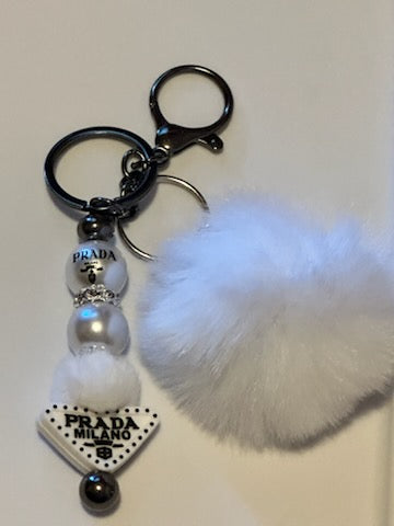 White Prada keychain