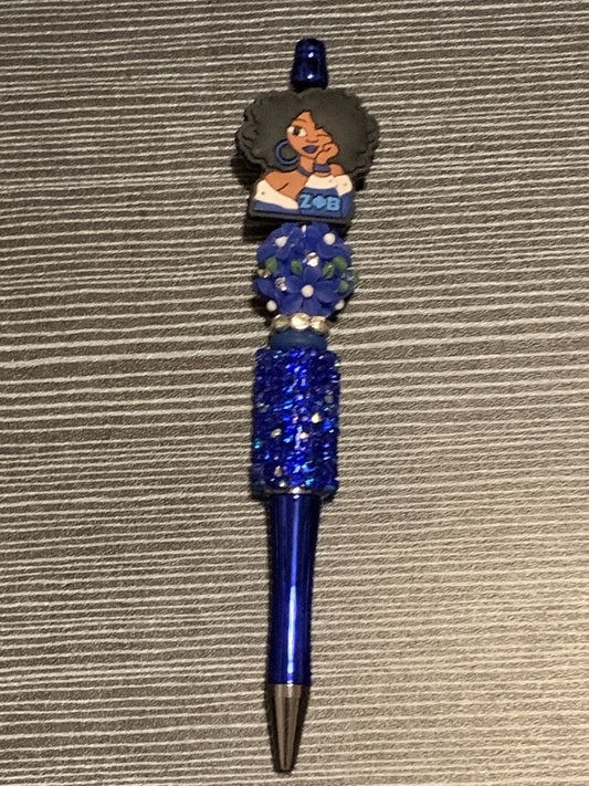 Zeta girl with blue flower on blue sparkle pen