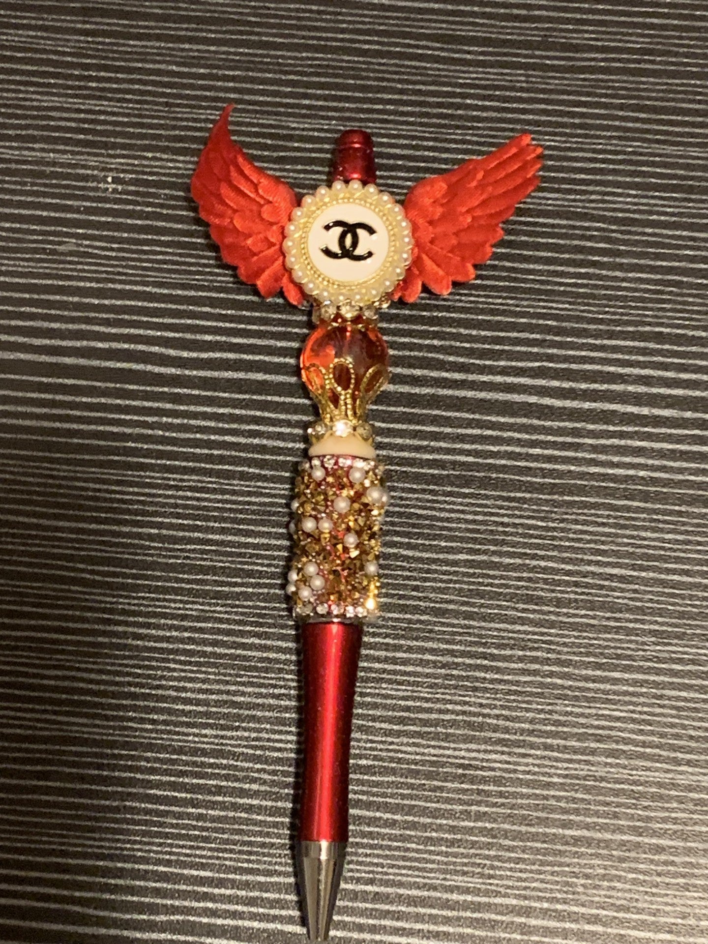 Red and Gold Chanel with wings