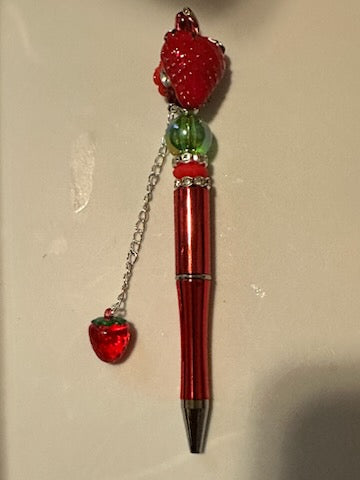 Strawberry pen with strawberry pendent hanging